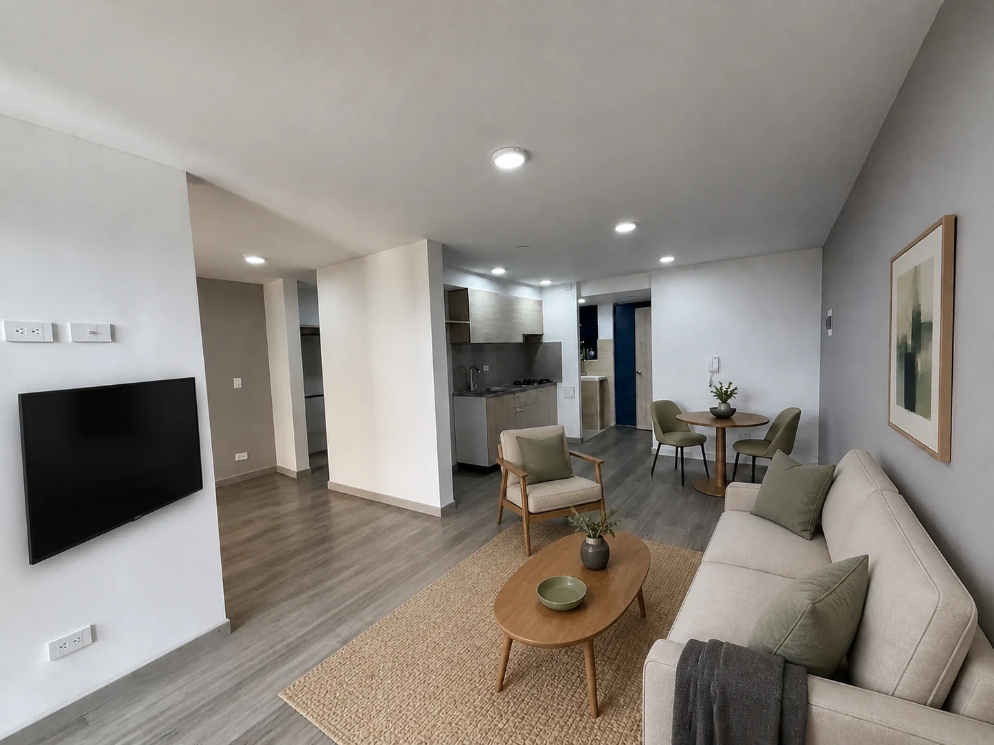 Zona social del apartamento 806 acondicionada virtualmente con sofá frente al televisor y circulación despejada hacia la alcoba